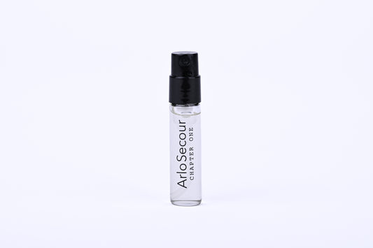 Small clear spray bottle with black cap on a white background